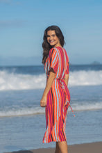 Load image into Gallery viewer, Red dress with purple, black, beige and light blue stripes - one size only. Dress for women or girls with transpassed, envelope style. Dress with short sleeves. You can wear as a beach cover up or to go out. Dress material: Viscolin. Made in Brazil.
