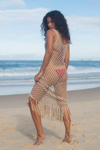 Beige see through Crochet Dress. it's being wore on top of a red crochet bikini.